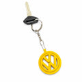 Yellow round logo keychain attached to a car key