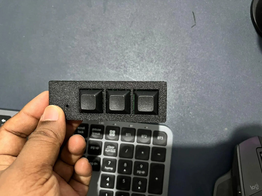 Black PicoPad 3x1 flat held in hand