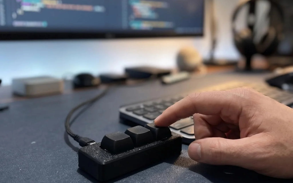 Hand pressing keys on the PicoPad 3x1 flat macro keyboard