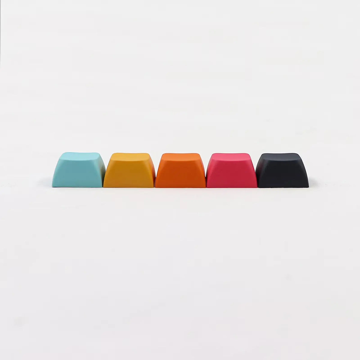 Row of XDA profile 1U keycaps side view showing low uniform profile